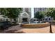 Elegant building entrance with water feature, manicured grounds, and covered entry at 795 Hammond Dr # 2007, Atlanta, GA 30328