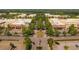 Aerial view of a commercial center with tree-lined streets and ample parking at 505 Godfrey Dr, Cumming, GA 30040