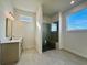 Modern bathroom with walk-in shower, floating vanity, and large window at 505 Godfrey Dr, Cumming, GA 30040