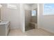 Bathroom featuring a glass shower with a bench and a vanity with a white countertop at 505 Godfrey Dr, Cumming, GA 30040
