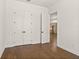 Bedroom featuring hardwood floors and double doors leading to another room at 505 Godfrey Dr, Cumming, GA 30040