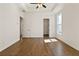 Spacious bedroom with hardwood floors, tray ceiling, and ample natural light at 505 Godfrey Dr, Cumming, GA 30040