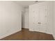 Bedroom featuring hardwood floors and double doors leading to another room at 505 Godfrey Dr, Cumming, GA 30040