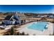 Community pool with outdoor seating and fire pit, perfect for relaxing and socializing in this luxurious neighborhood at 505 Godfrey Dr, Cumming, GA 30040