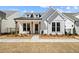 Charming new construction home featuring a manicured lawn and craftsman-style details at 505 Godfrey Dr, Cumming, GA 30040