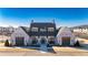 Stunning exterior view of a clubhouse with elegant brick and siding, complemented by lush landscaping at 505 Godfrey Dr, Cumming, GA 30040