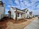 Row of charming white houses with front porches at 505 Godfrey Dr, Cumming, GA 30040