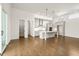 Open-concept kitchen with modern appliances, island, hardwood floors and ample cabinet space at 505 Godfrey Dr, Cumming, GA 30040