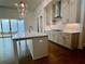 Contemporary kitchen island with quartz countertops, a chrome faucet, and sleek, modern cabinets at 505 Godfrey Dr, Cumming, GA 30040