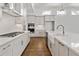 Well-appointed kitchen with sleek countertops, subway tile backsplash and modern appliances at 505 Godfrey Dr, Cumming, GA 30040
