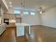 Open concept kitchen with an island and hardwood floors at 505 Godfrey Dr, Cumming, GA 30040