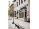 Sugar Polish Nail Bar storefront with shaded outdoor seating and brick sidewalks at 505 Godfrey Dr, Cumming, GA 30040