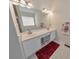 Well-lit bathroom with double sink vanity, a large mirror, and neutral decor at 3076 Harris Mill Ct, Duluth, GA 30096