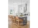 Contemporary farmhouse kitchen featuring stainless steel appliances, island with bar stools and neutral finishes at 597 Federal Se Ter, Atlanta, GA 30315