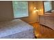 Spacious bedroom with hardwood floors and large window at 1010 Scott Blvd # A8, Decatur, GA 30030