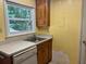 Kitchen features wood cabinets, white appliances, and a sink at 1010 Scott Blvd # A8, Decatur, GA 30030