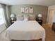 Inviting bedroom with a plush bed, stylish nightstands, and soothing wall art at 5895 Mattan Trl, Lithonia, GA 30058