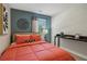 Bedroom featuring an accent wall and a work area at 5895 Mattan Trl, Lithonia, GA 30058