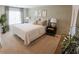 Cozy bedroom with neutral tones, a comfortable bed, and ample natural light at 5895 Mattan Trl, Lithonia, GA 30058