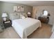 Bedroom featuring a large window with curtains and a dresser with a round mirror above it at 5895 Mattan Trl, Lithonia, GA 30058