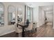 Dining area view to the kitchen offers an open concept with sleek floors and stylish decor at 5895 Mattan Trl, Lithonia, GA 30058