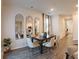 Dining area with modern lighting, a dark wood table, and six chairs at 5895 Mattan Trl, Lithonia, GA 30058