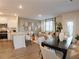 Bright open concept living space with eat in kitchen featuring stainless steel appliances and modern decor at 5895 Mattan Trl # 68, Lithonia, GA 30058