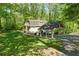 Lovely home exterior with a carport and well-manicured lawn at 3125 Lakeside Dr, Cumming, GA 30041