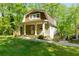 Picturesque house exterior with a charming front porch and landscaping at 3125 Lakeside Dr, Cumming, GA 30041