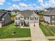 Two-story house with a large yard and driveway, located in a residential neighborhood at 90 Piedmont Cir, Covington, GA 30016