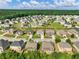 Aerial view of a residential neighborhood with tree-lined streets and well-maintained lawns at 90 Piedmont Cir, Covington, GA 30016