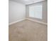 Neutral bedroom features a carpeted floor and bright natural light from a window at 90 Piedmont Cir, Covington, GA 30016