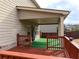 Covered back deck, complete with an area of green turf at 90 Piedmont Cir, Covington, GA 30016