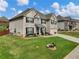 Two-story house with brick and siding, large windows, and a landscaped yard at 90 Piedmont Cir, Covington, GA 30016