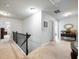 Upstairs hallway with carpeted floor and access to bedrooms at 90 Piedmont Cir, Covington, GA 30016