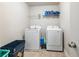 Laundry room with washer, dryer, and ample storage at 90 Piedmont Cir, Covington, GA 30016