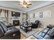 Relaxing living room with fireplace, large TV, and comfortable seating at 90 Piedmont Cir, Covington, GA 30016