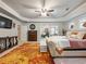 Main bedroom with cozy sitting area and large format area rug at 90 Piedmont Cir, Covington, GA 30016