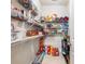 Well-stocked pantry with ample shelving for storage at 90 Piedmont Cir, Covington, GA 30016