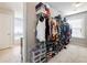 Large walk-in closet with ample hanging space and shoe storage at 90 Piedmont Cir, Covington, GA 30016