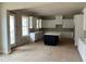 Spacious kitchen with white cabinets, large island, and breakfast bar at 1077 Sweet Mia Ln, Powder Springs, GA 30127