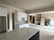 Open kitchen with white cabinets and a large center island at 1077 Sweet Mia Ln, Powder Springs, GA 30127
