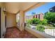 Spacious tiled balcony offering views of lush landscaping and nearby buildings on a sunny day at 211 Colonial Homes Dr # 2304, Atlanta, GA 30309