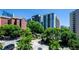 Scenic view of condominium community surrounded by mature trees and manicured landscaping at 211 Colonial Homes Dr # 2304, Atlanta, GA 30309