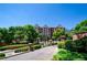 Gated community with mature trees and well-maintained landscaping provides an inviting entrance at 211 Colonial Homes Dr # 2304, Atlanta, GA 30309