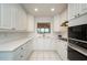 Kitchen featuring white cabinets, stainless steel appliances, and ample counter space at 211 Colonial Homes Dr # 2304, Atlanta, GA 30309
