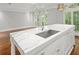 Kitchen island with marble countertop and stainless steel sink at 2960 S Pharr Nw Ct # N2, Atlanta, GA 30305