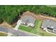 Luxury home with landscaped lawn and driveway located in a wooded area at 5693 Brendlynn Dr, Suwanee, GA 30024