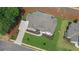Luxury home with gray roof and a large, landscaped yard at 5693 Brendlynn Dr, Suwanee, GA 30024