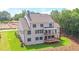 Luxury home with large backyard, deck and stone exterior at 5693 Brendlynn Dr, Suwanee, GA 30024